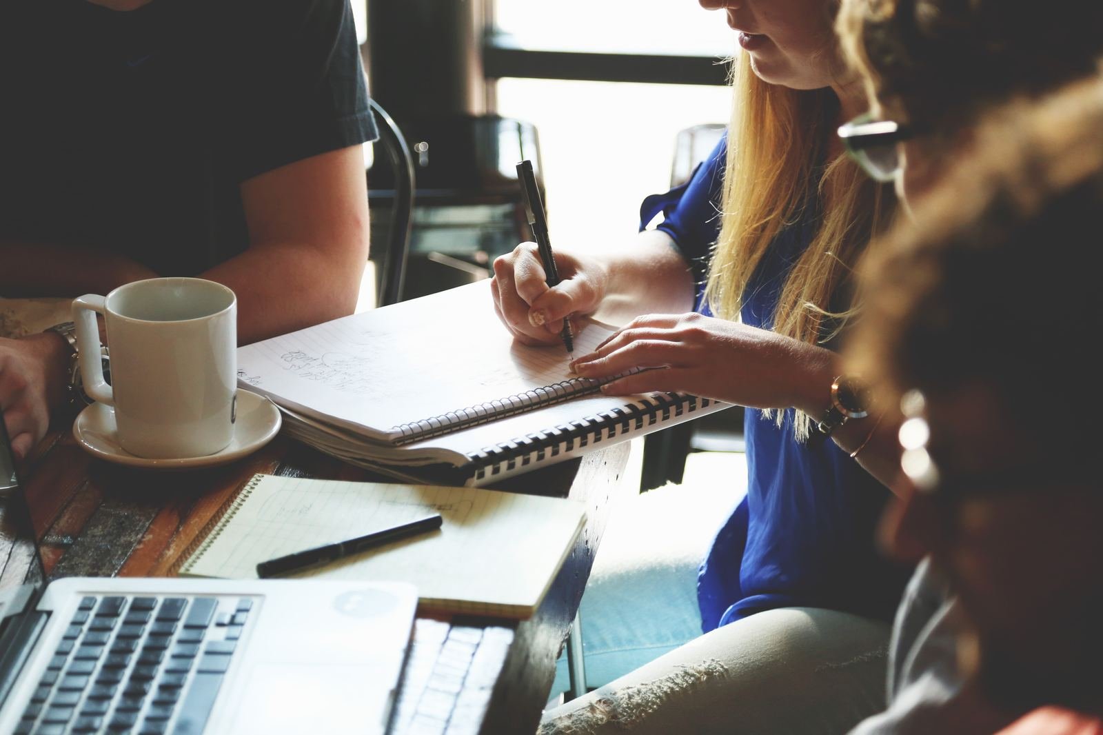 Founder taking notes in a working session